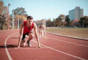 Track starting line with two runners 